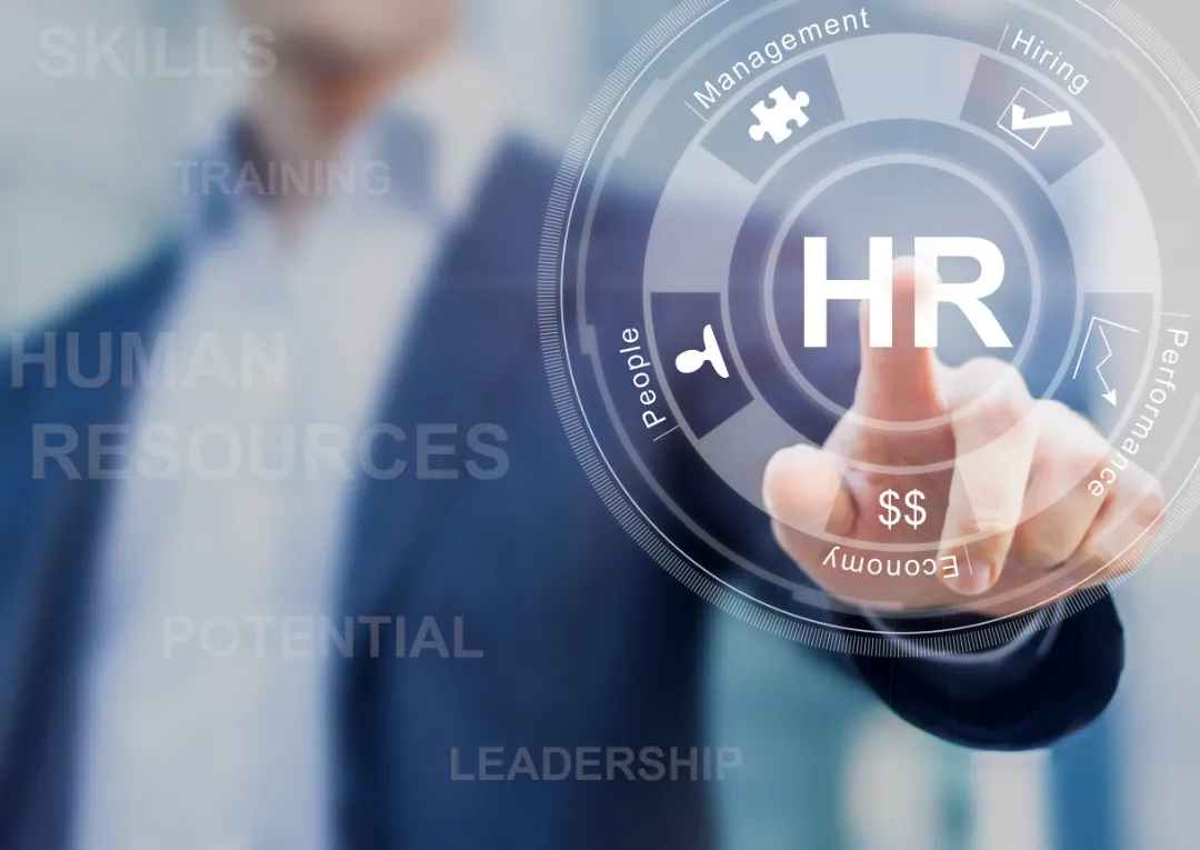 A business professional interacts with a digital HR interface, highlighting terms like management, hiring, and performance metrics.